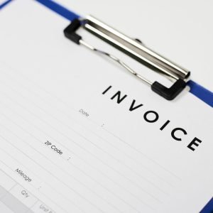 A closeup shot of an invoice document on a white surface